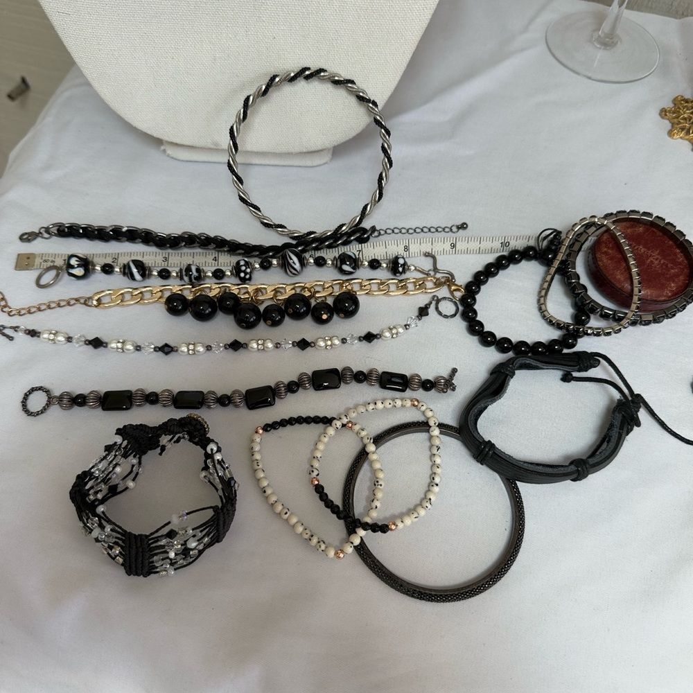 Large group of 14 black vibe bracelets